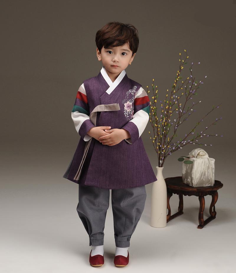 Young boy wearing a royal purple hanbok