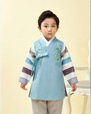 Young boy wearing a slate blue hanbok and arms out