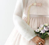 Closeup of sleeve of custom womens bridal hanbok in lace and pastel pink style