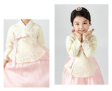 Young girl cute smile and wearing a girls korean hanbok with pastel yellow top and pink skirt