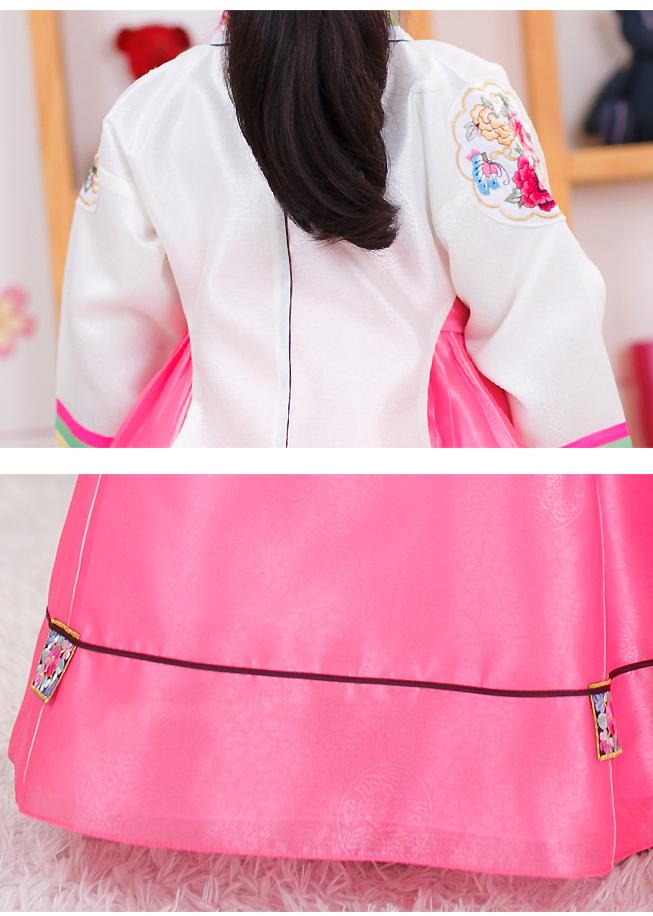 Closeup of girls korean hanbok with white top and red skirt
