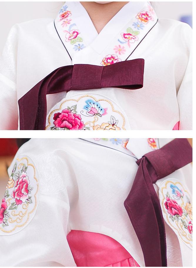 Closeup of girls korean hanbok with white top and red skirt