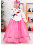 Young girl wearing a girls korean hanbok with white top and pink skirt