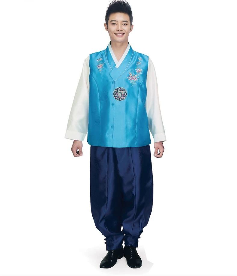man wearing men's korean hanbok with blue top and navy pants